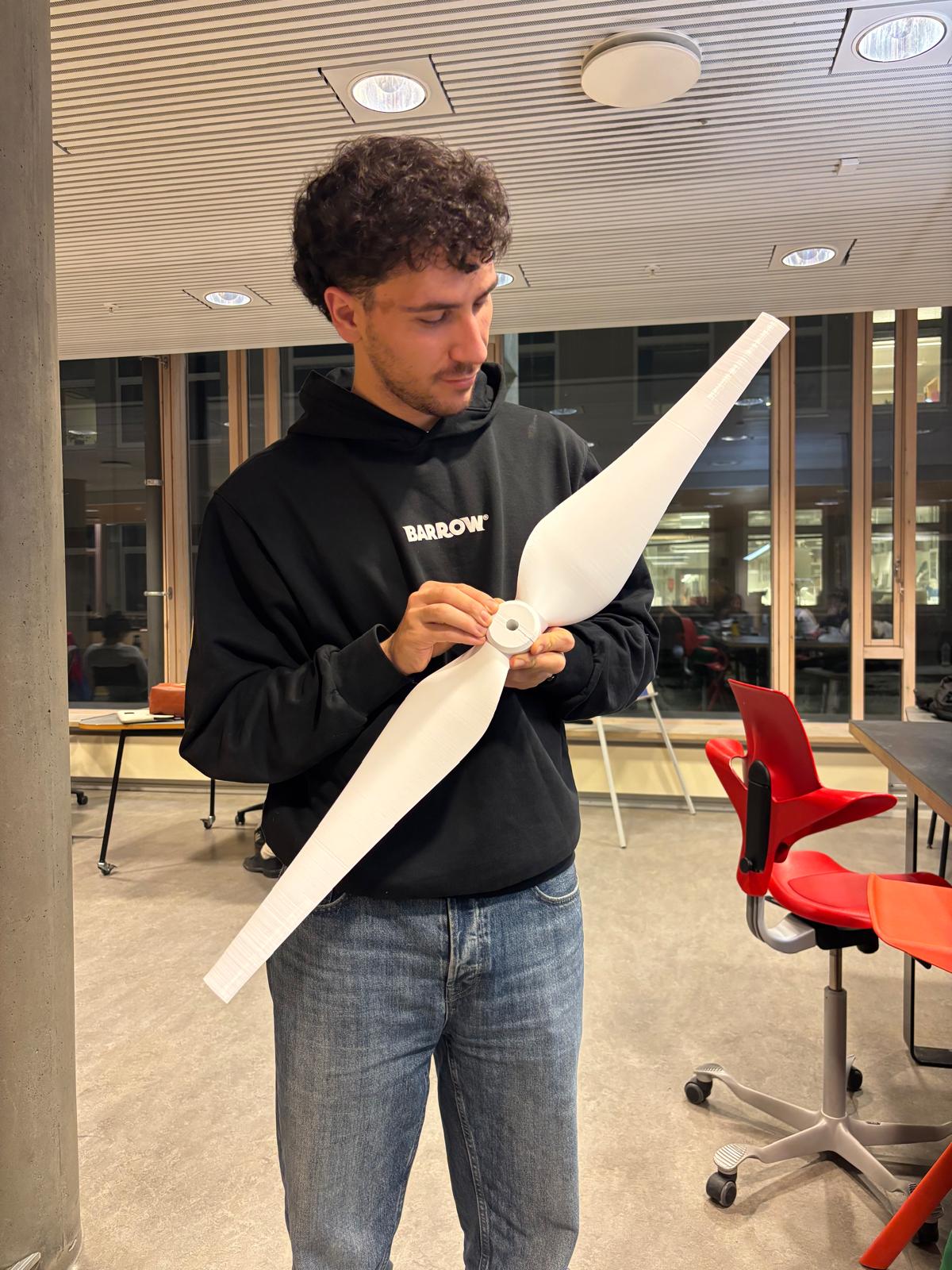 FDM printed wind turbine blade prototype held during assembly